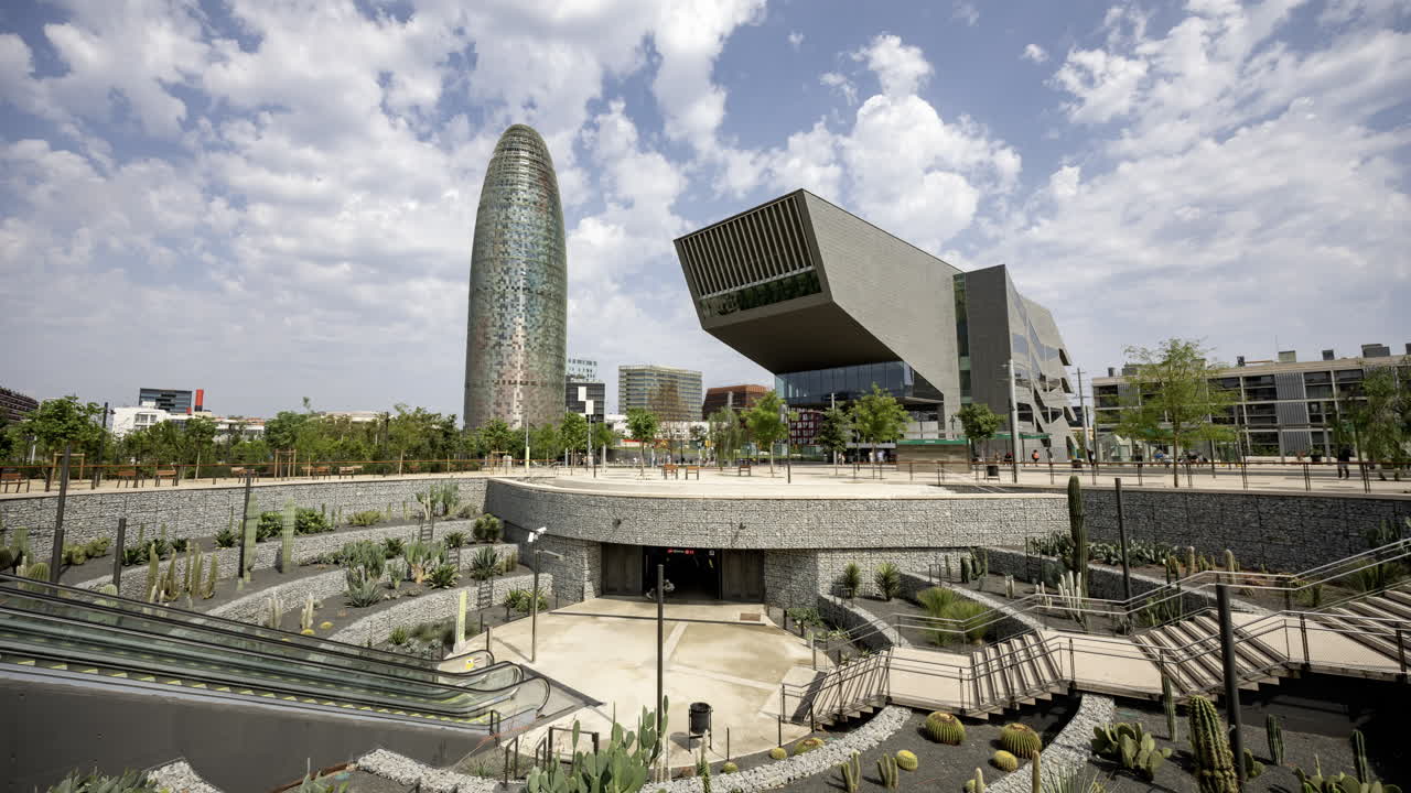 Timelapse of Glories Metro Station In Barcelona and skyline