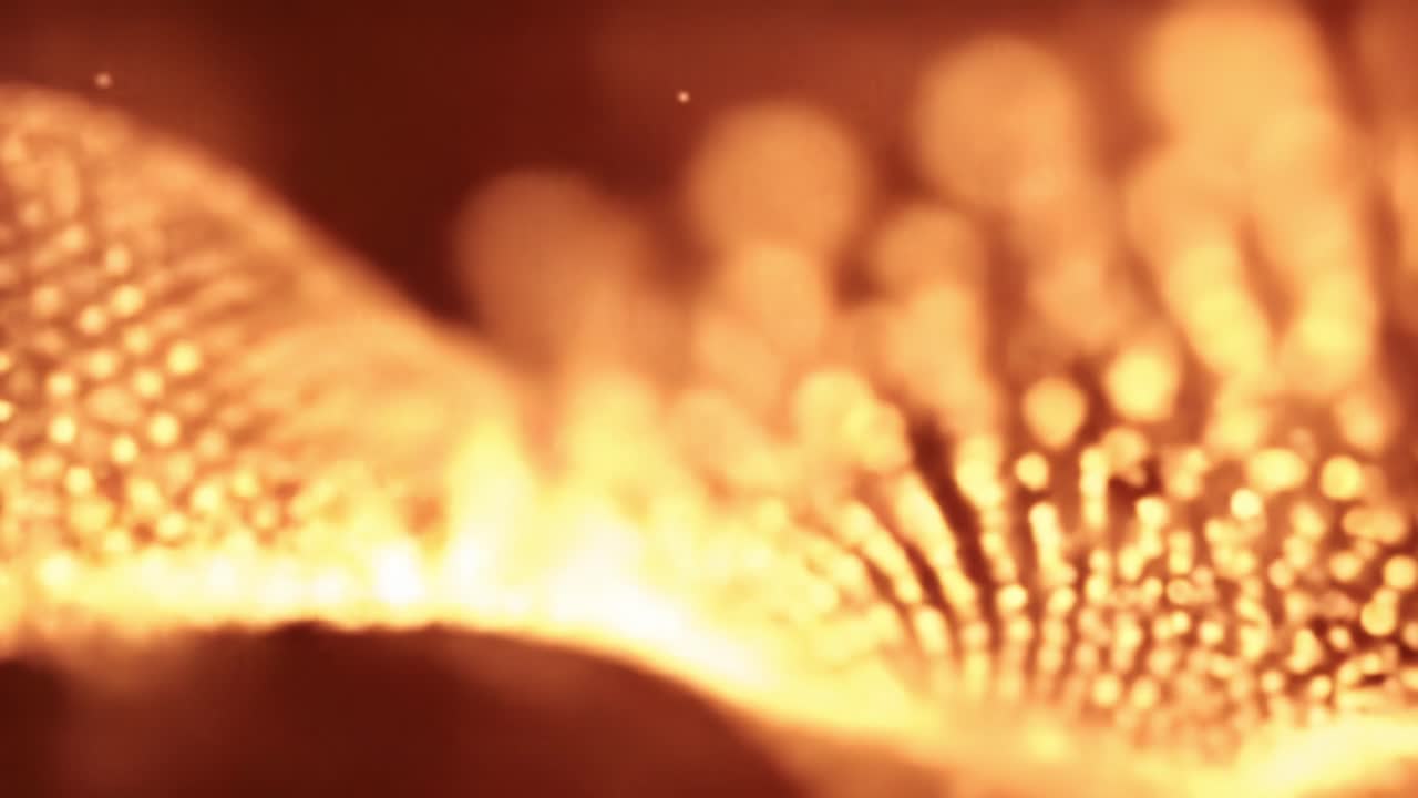 Golden bubbles dance and shimmer in a viscous liquid as the sun sets, casting a warm glow over the city skyline and creating a mesmerizing visual experience.