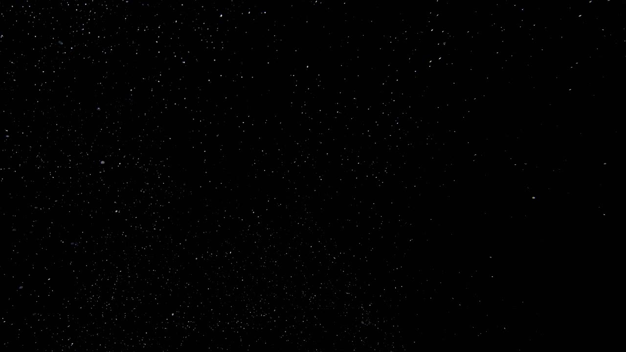 Dust floating in the air on black background  04