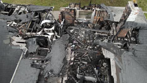 Remains-of-burned-private-estate,-aerial-drone-view