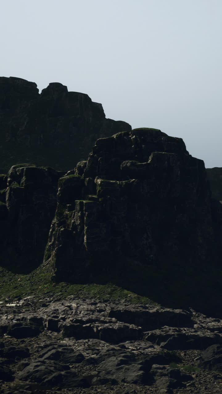 Majestic rocky landscape under a hazy sky at dusk in a remote location