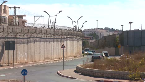 cars drive along the new west bank barrier between israel and the palestinian territories 1