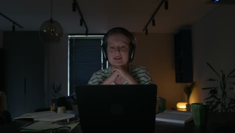 woman studying late at night on laptop