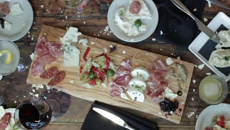 Friends-cheers-over-dinner-table-at-trendy-restaurant