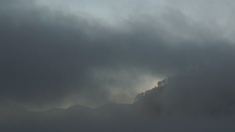 low clouds and fog spreading filling the frame in evening at the sacred valley, cusco