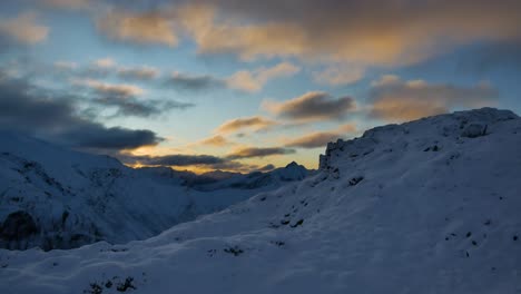 scenic sunset behind the snowy mountains in fiordland, kepler trek in new zealand