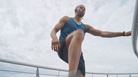 fitness, man and marathon runner stretching legs