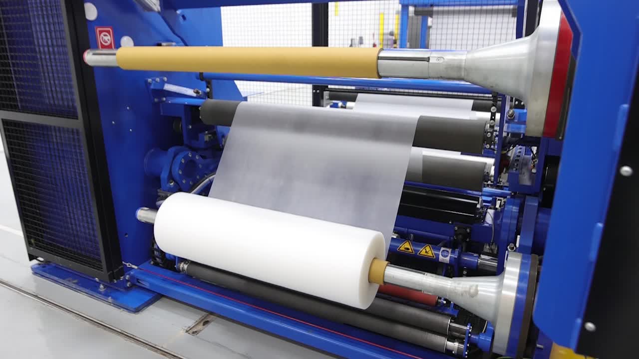 Plastic EVA film roll rewinding at machine with high speed