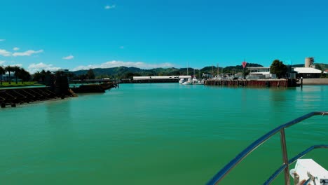 Witness-the-graceful-return-of-a-boat-to-the-peaceful-dock,-a-serene-maritime-scene-that-symbolizes-the-tranquility-and-charm-of-waterfront-living