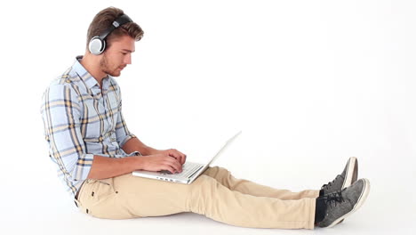 handsome young man using laptop