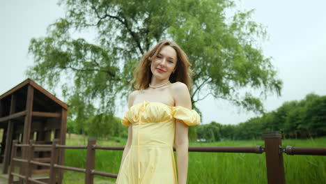 seductive ukrainian girl in a yellow dress posing in the countryside