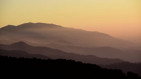 time lapse of foggy landscape of mountains layers