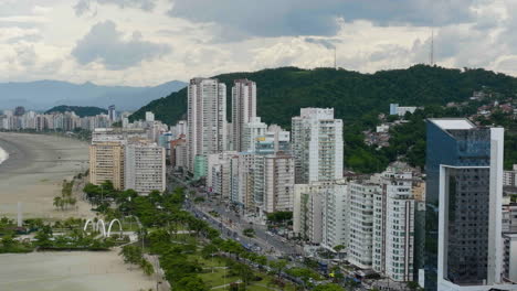 aerial view of condos on the coastline of santos city, partly sunny day in brazil
