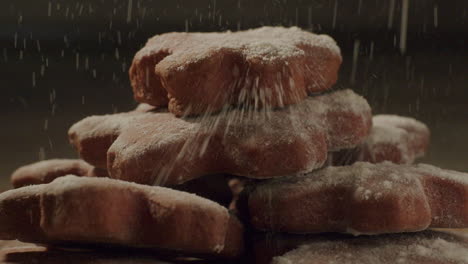 a-stack-of-cookies-getting-sprinkled-sugar-on-top,-static-close-up