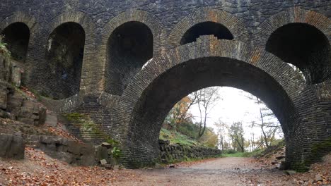 stone arched bridge ruins in autumn rivington ornamental woodland gardens