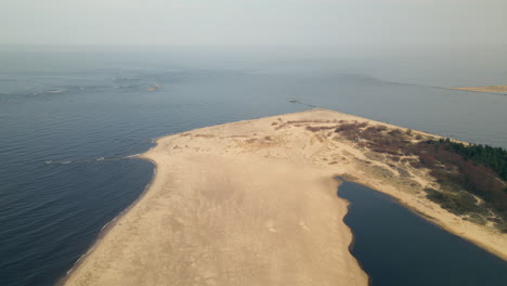 vistula river through sand dune beach in baltic sea at mewia lacha nature reserve in poland