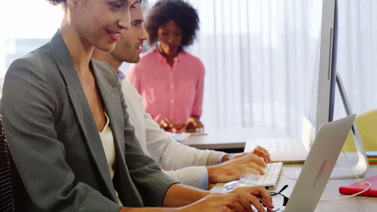 Businesswoman working on laptop at desk