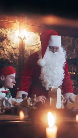 children and elves play with santa claus toys at the christmas residence. vertical video