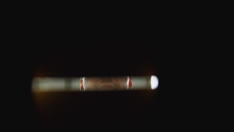 point of view shot of male worker in distribution warehouse closing and sealing box