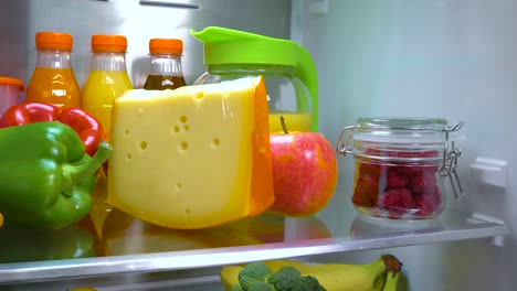 Open-refrigerator-filled-with-food