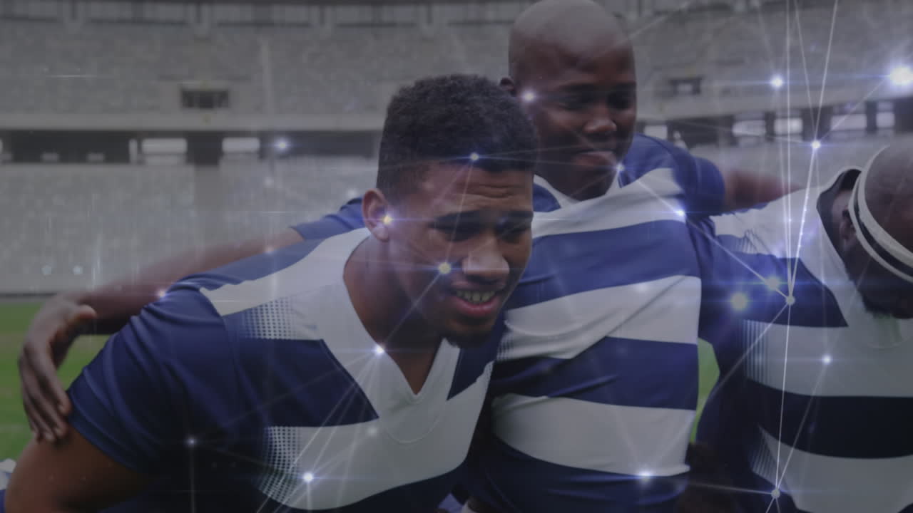 Animation of network of connections over team of diverse male rugby players defending together