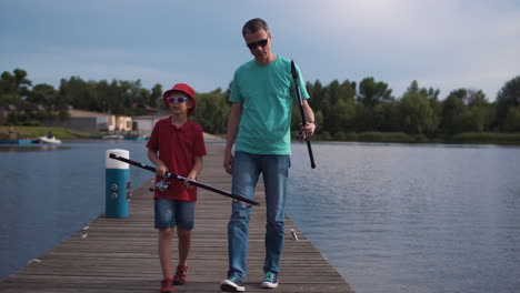 father and son fishing on a lakeside pier