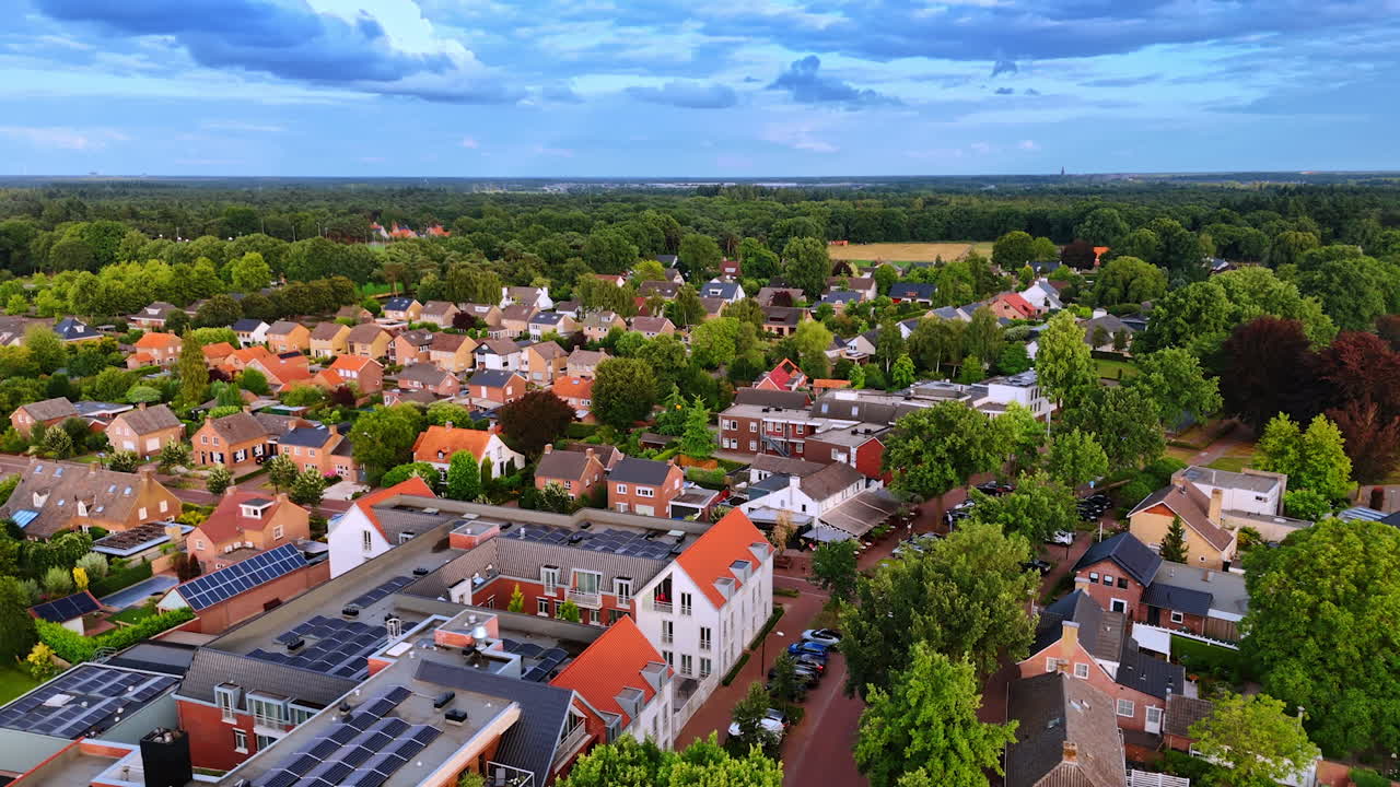 Residential Dutch neighborhood from above. High-angle view of residential Dutch streets lined with gardens and rooftops