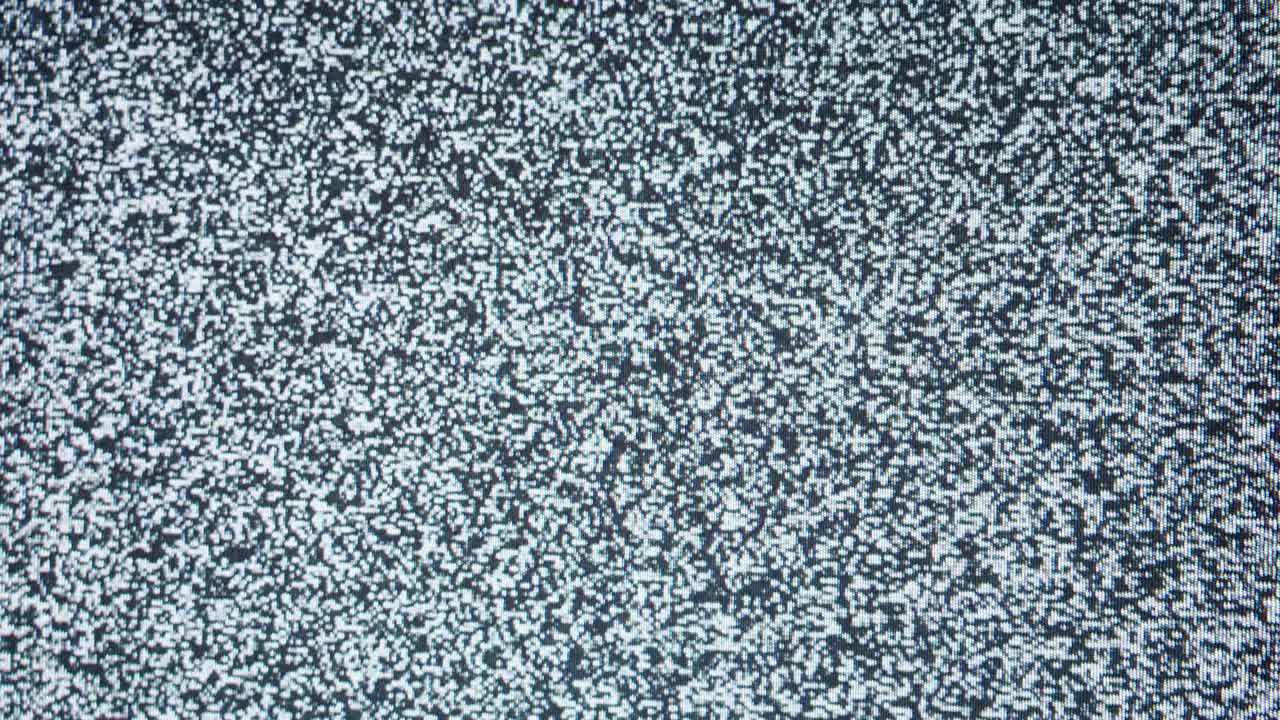 Old retro television screen with ripples, wavy flowing damaged signal. Close-up of broken old-fashioned TV with noise, bad signal reception, cinematography concept
