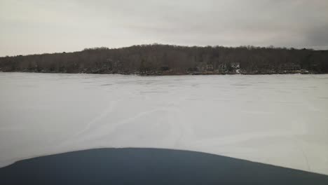 Geese-swimming-in-a-frozen-lake-in-the-Pocono-Mountains-during-winter