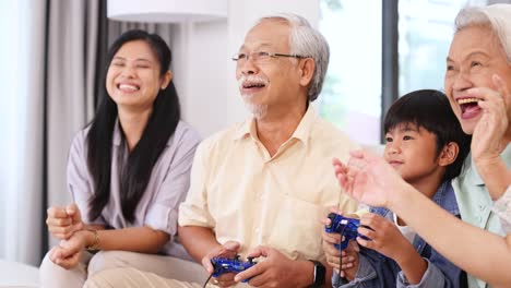 a joyful family of different generations playing video games in a bright living room, showcasing laughter and bonding