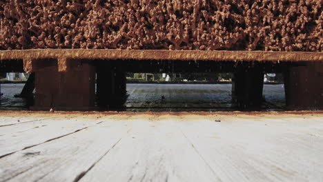 salt water drips through the bundles of brushwood in a graduation tower