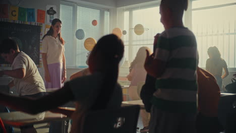 female teacher greeting young boys and girls at th 2025 07 31 02 03 07 utc.mov | back to school, backpack, beginning, boy