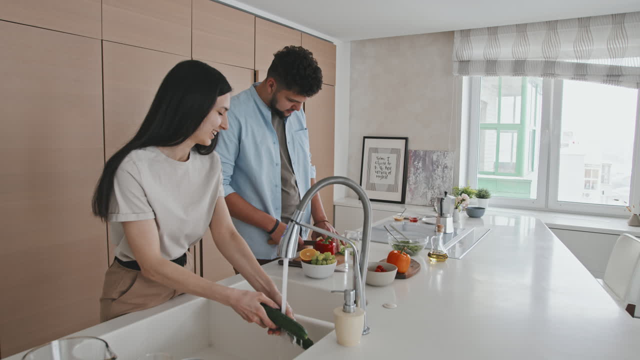 Young Latino Couple At Modern Kitchen