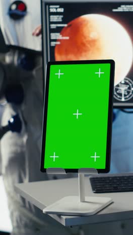 vertical video astronaut waves hand during videocall with earth command center