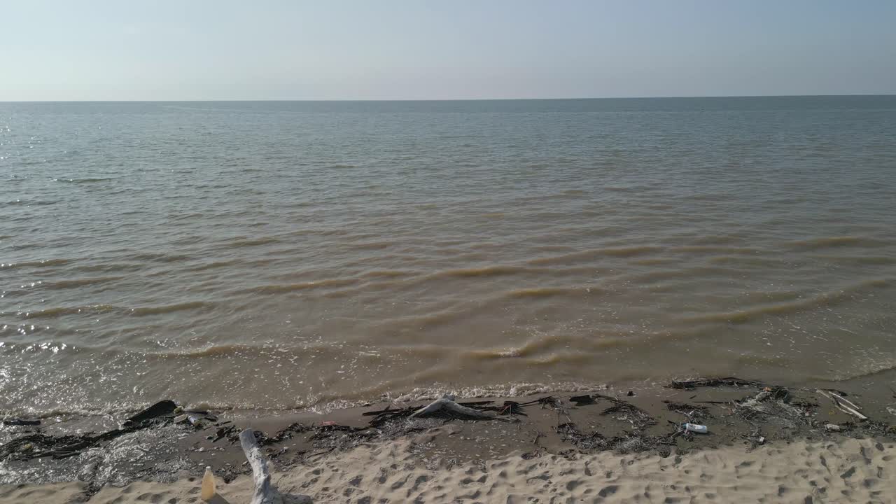 Aerial Drone View During Summer Alit Fishing Village,Kabong With, Facing Open Blue Sea, White Sandy Beach,Green Coconut, Palm Trees,And River,Sarawak,Borneo
