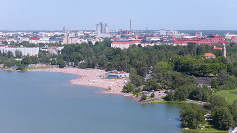 telephoto drone shot of the crowded hietaranta beach, summer day in helsinki