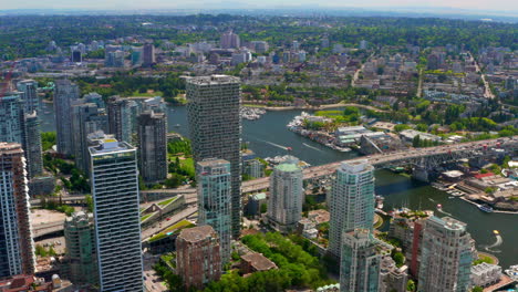 Aerial-View-Of-High-rise-Buildings-With-Granville-Bridge-And-Island-In-West-End,-Vancouver,-Canada