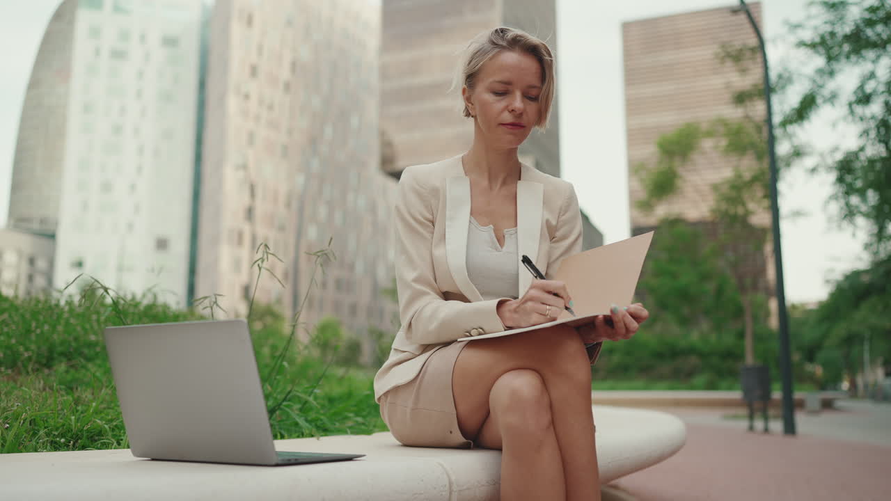 Businesswoman working outdoors in the city