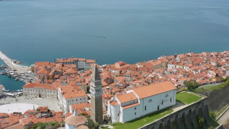 aerial: beautiful piran town on adriatic coast, iconic slovenia destination