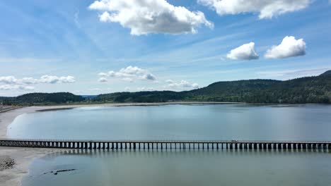 Wide-aerial-shot-of-the-large-foot-bridge-crossing-Fidalgo-Bay