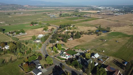 Flying-over-a-cluster-of-rural-homes-in