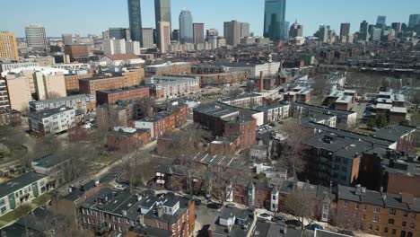 aerial pan up reveals boston city skyline on picturesque day