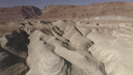 desert landscape with eroded hills and mountains