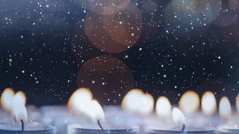 velas combinadas con la nieve que cae