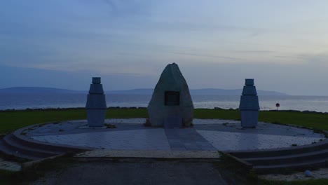 static shot of the galway famine ship memorial at twiligh