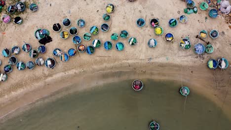 topdown view of mui ne beach with colorful boats from fish market on sand , binh thuan vietnam