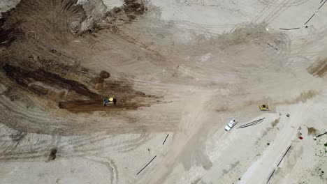 4K-Aerial-Overhead-View-Of-A-Quarry-With-A-Moving-Construction-Vehicle