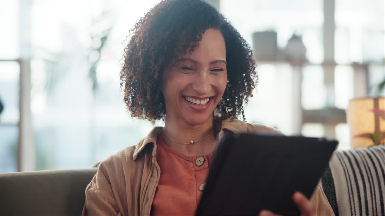 Woman Using Tablet at Home