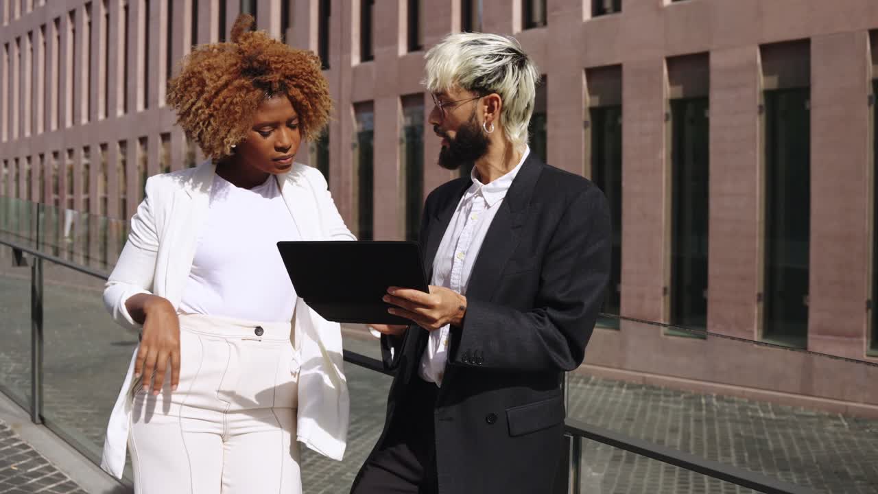 Business meeting outdoors with tablet