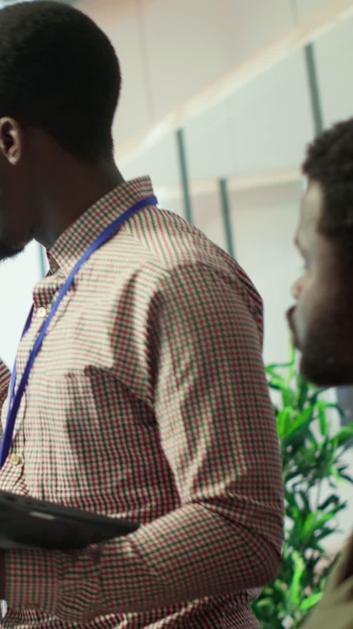 Vertical Video Teammates assembling in a boardroom to go over their analysis results
